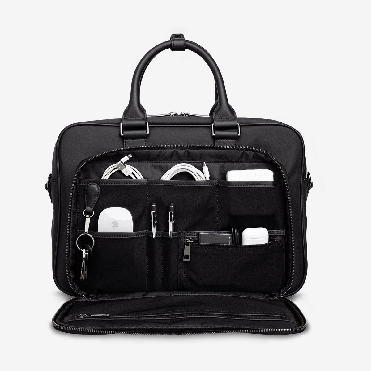 The black Alto with its front organiser open, holding cables, a charger, pens and keys