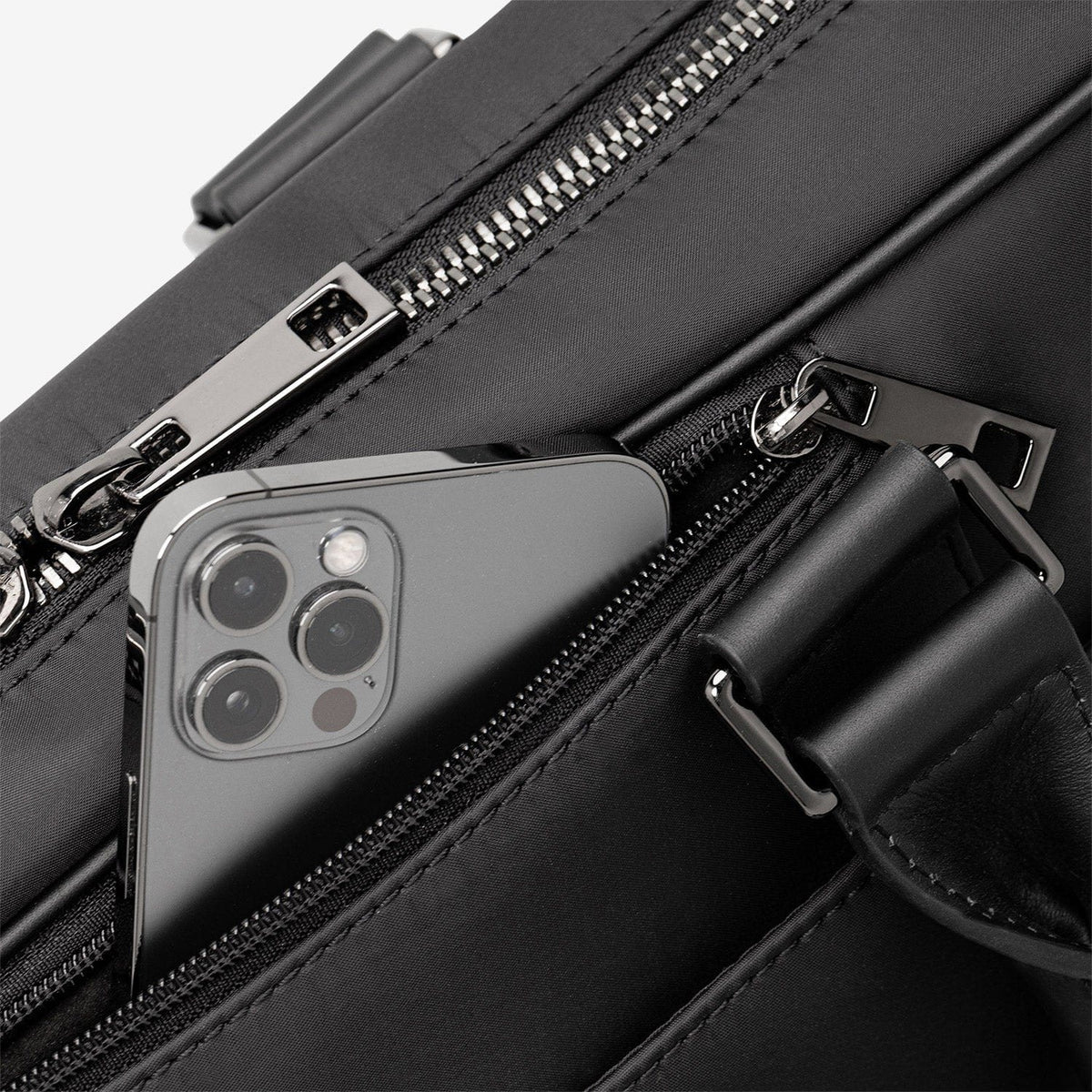 A phone in the Alto's zipped quick-access pocket