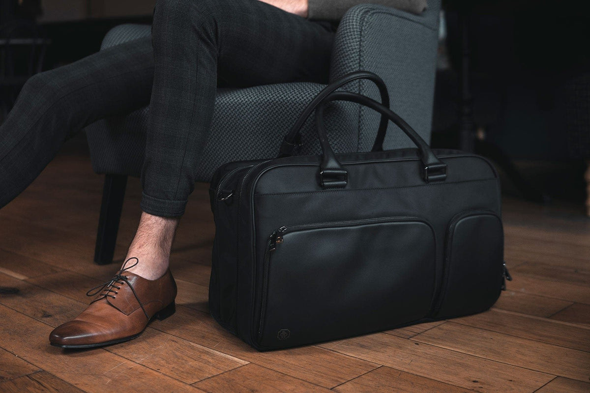 A man with the Kennedy Weekender at his feet